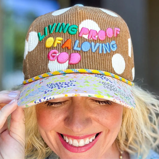 Embroidered baseball cap “living proof of a loving God”
