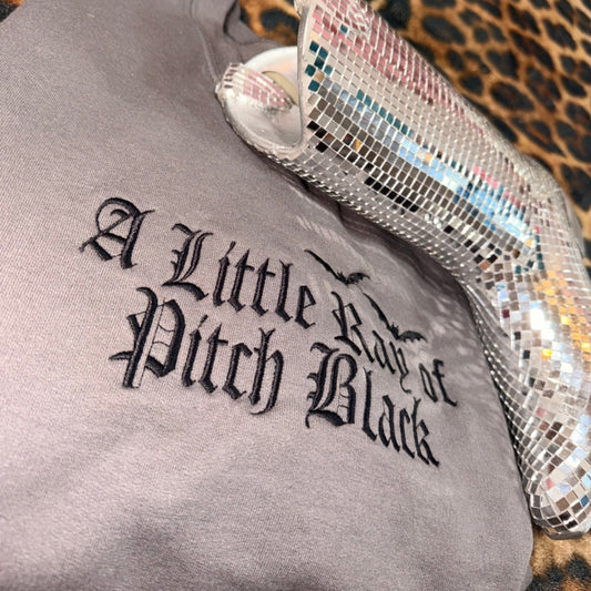 “A little ray of pitch black” embroidered sweatshirt