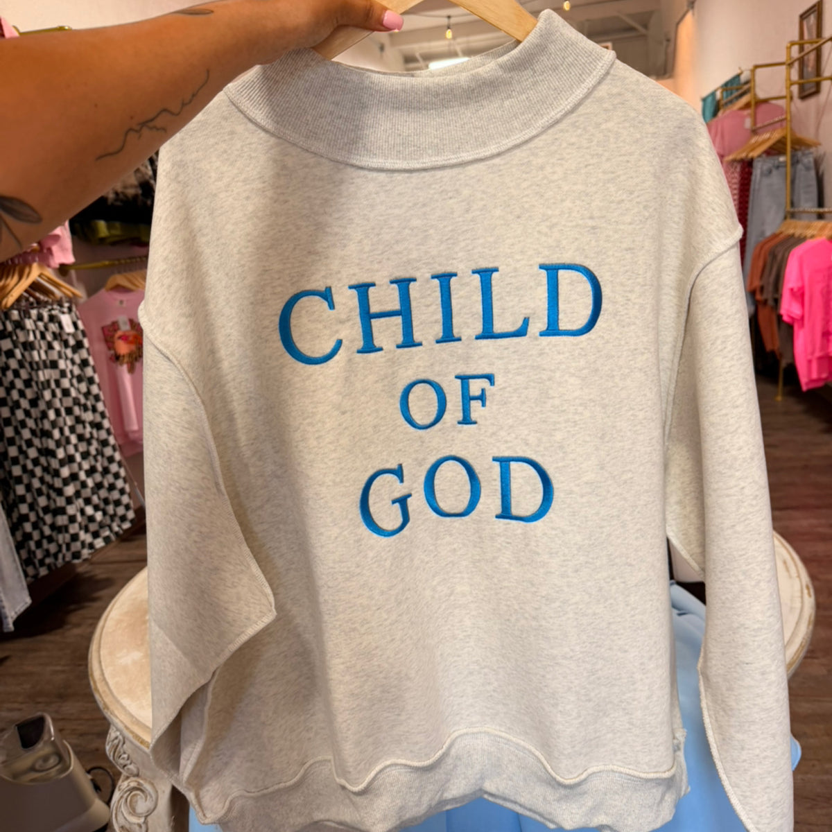 “Child of God” embroidered mockneck